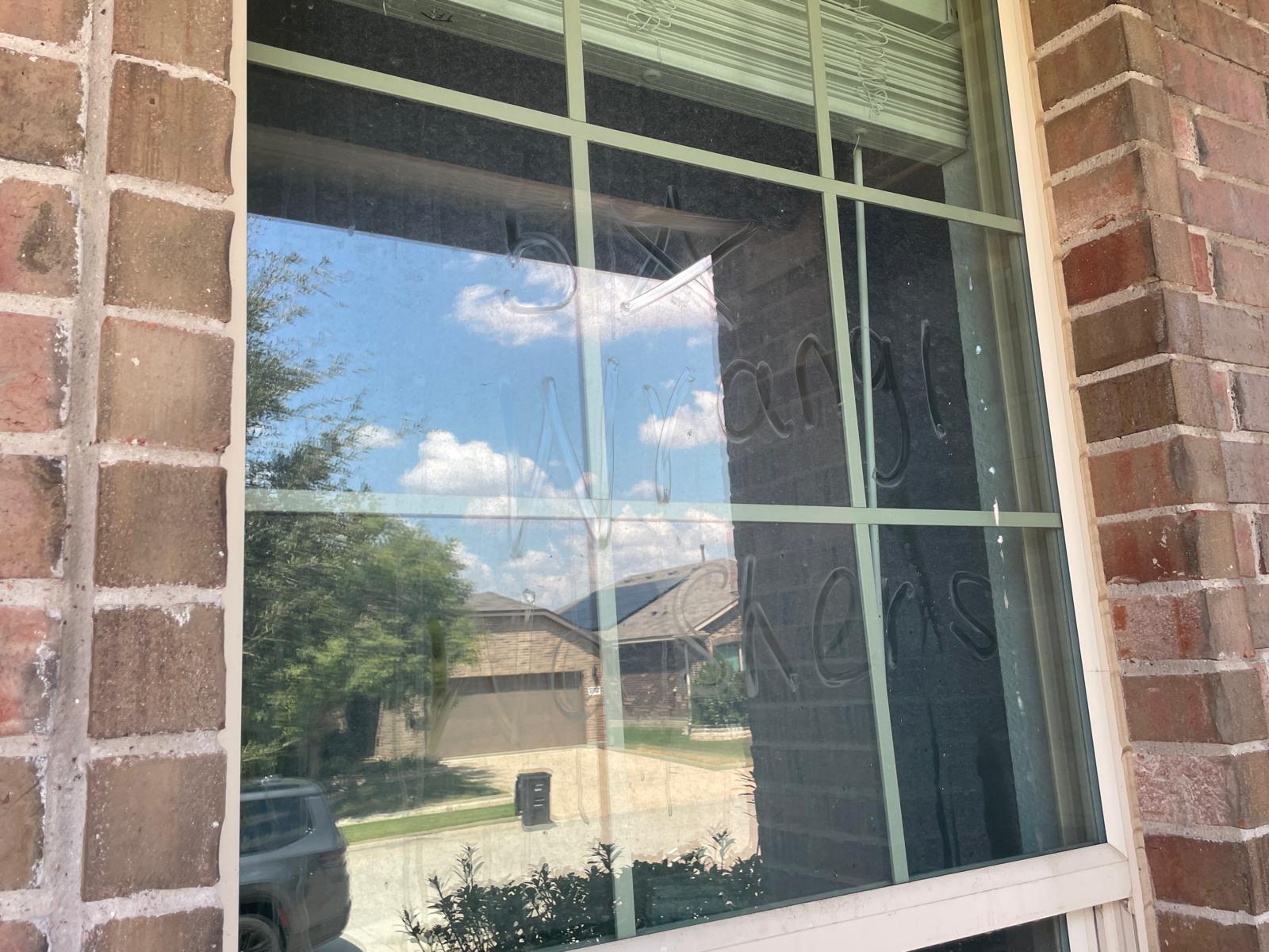 Exterior home window with dust and film before professional cleaning