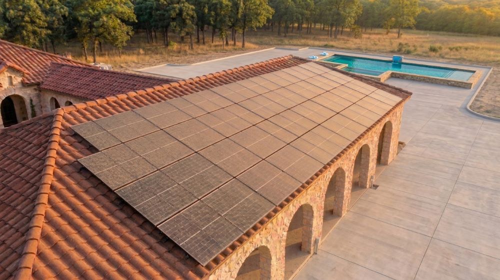 Solar panels before professional cleaning, dusty brown panels on a tile roof