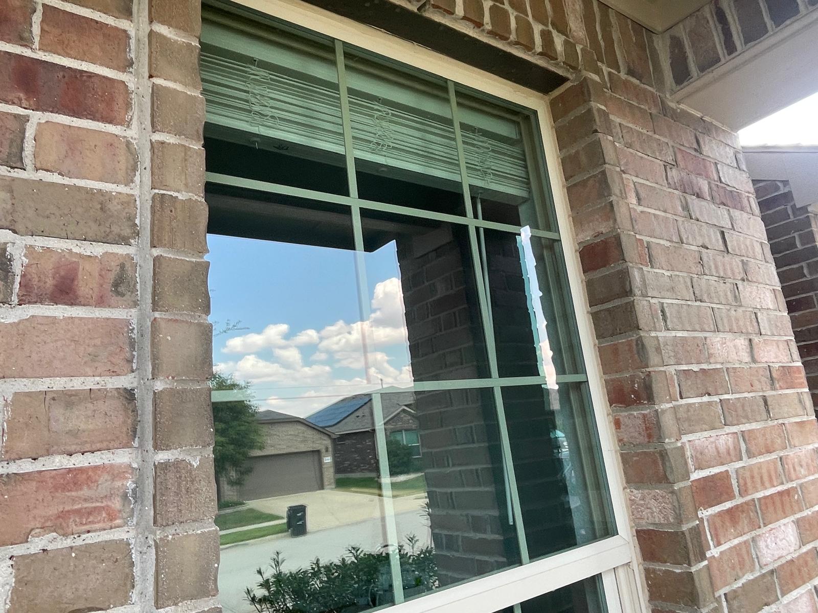 Exterior home window crystal clear with reflection after professional cleaning