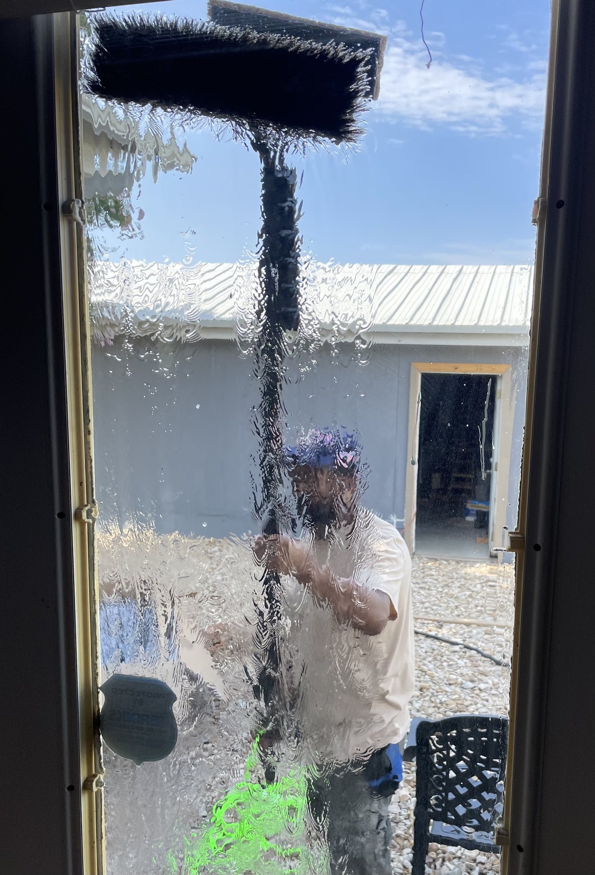 Looking out through a freshly cleaned window with pure-water reflection