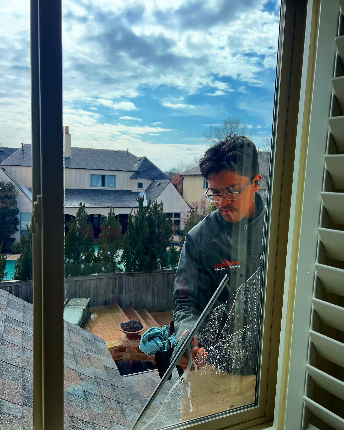Luminous Window Cleaning tech doing detailed window work