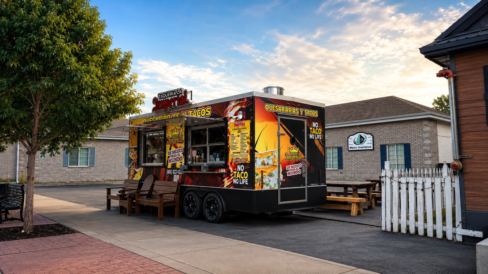 Taqueria La Imperial outdoor kitchen trailer with ordering window and picnic seating on Main Street in Heber City