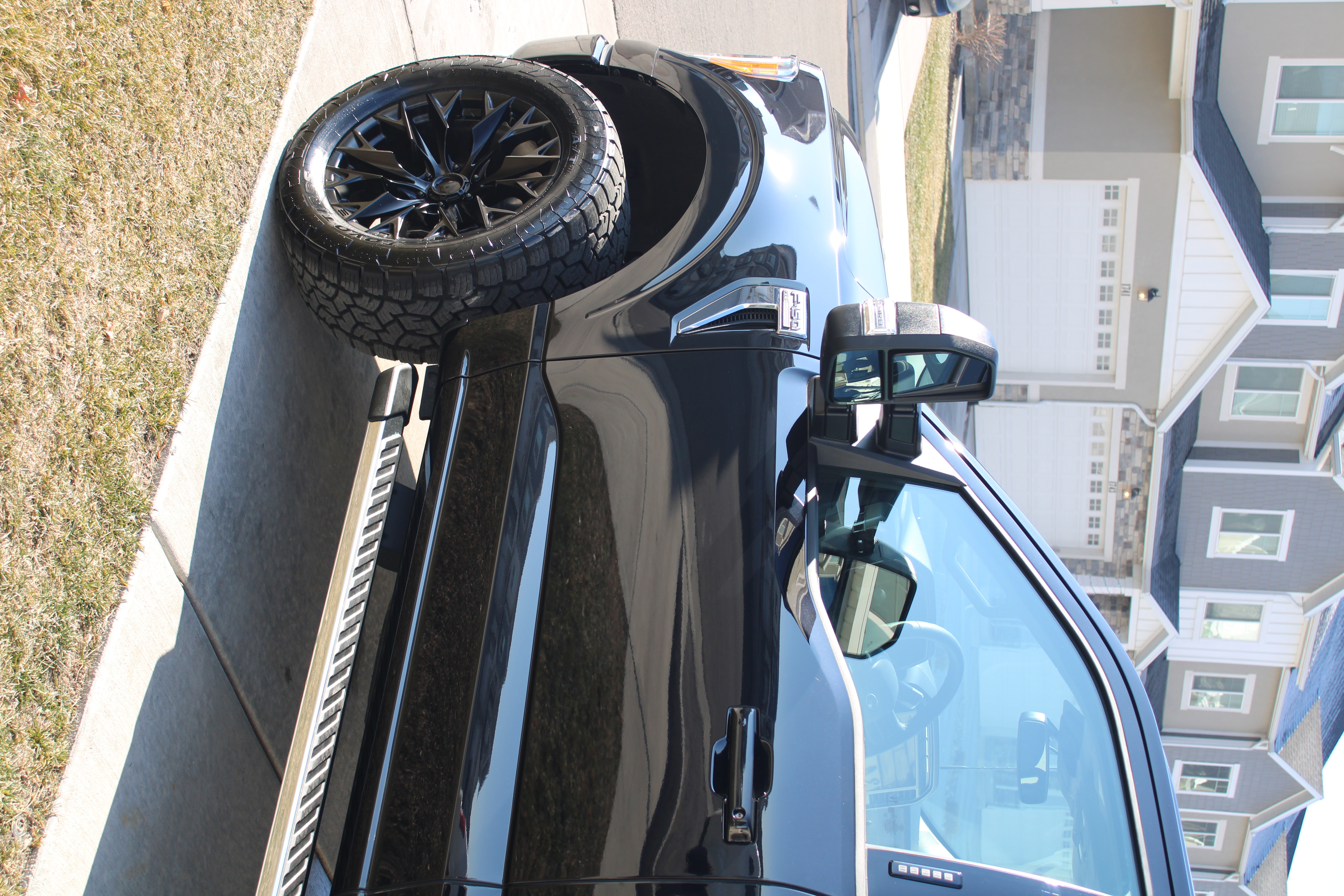 Ceramic-coated matte black truck detailed for a Saratoga Springs neighborhood client