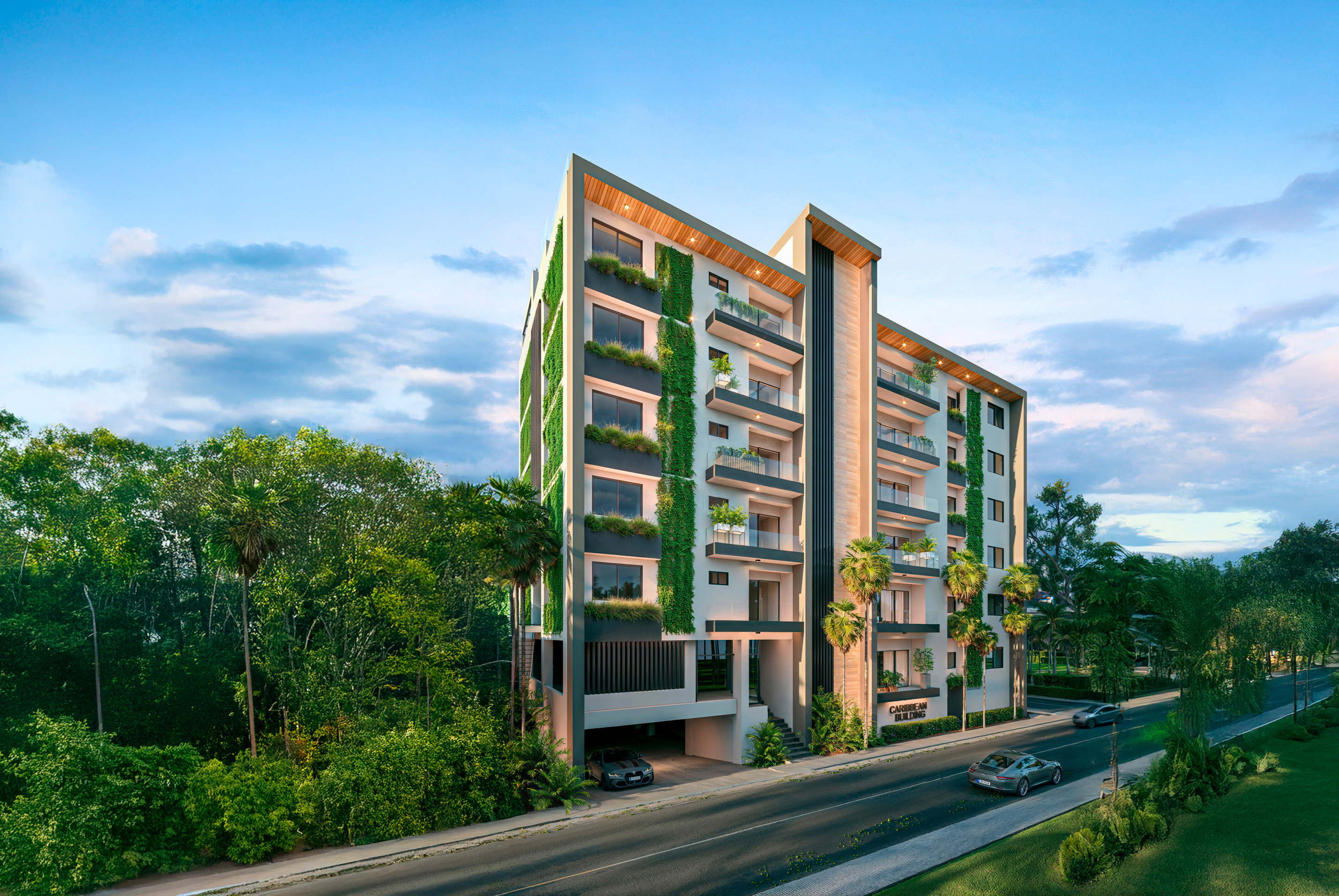 Exterior de día del Caribbean Bay Building con jardines verticales en La Caleta, República Dominicana