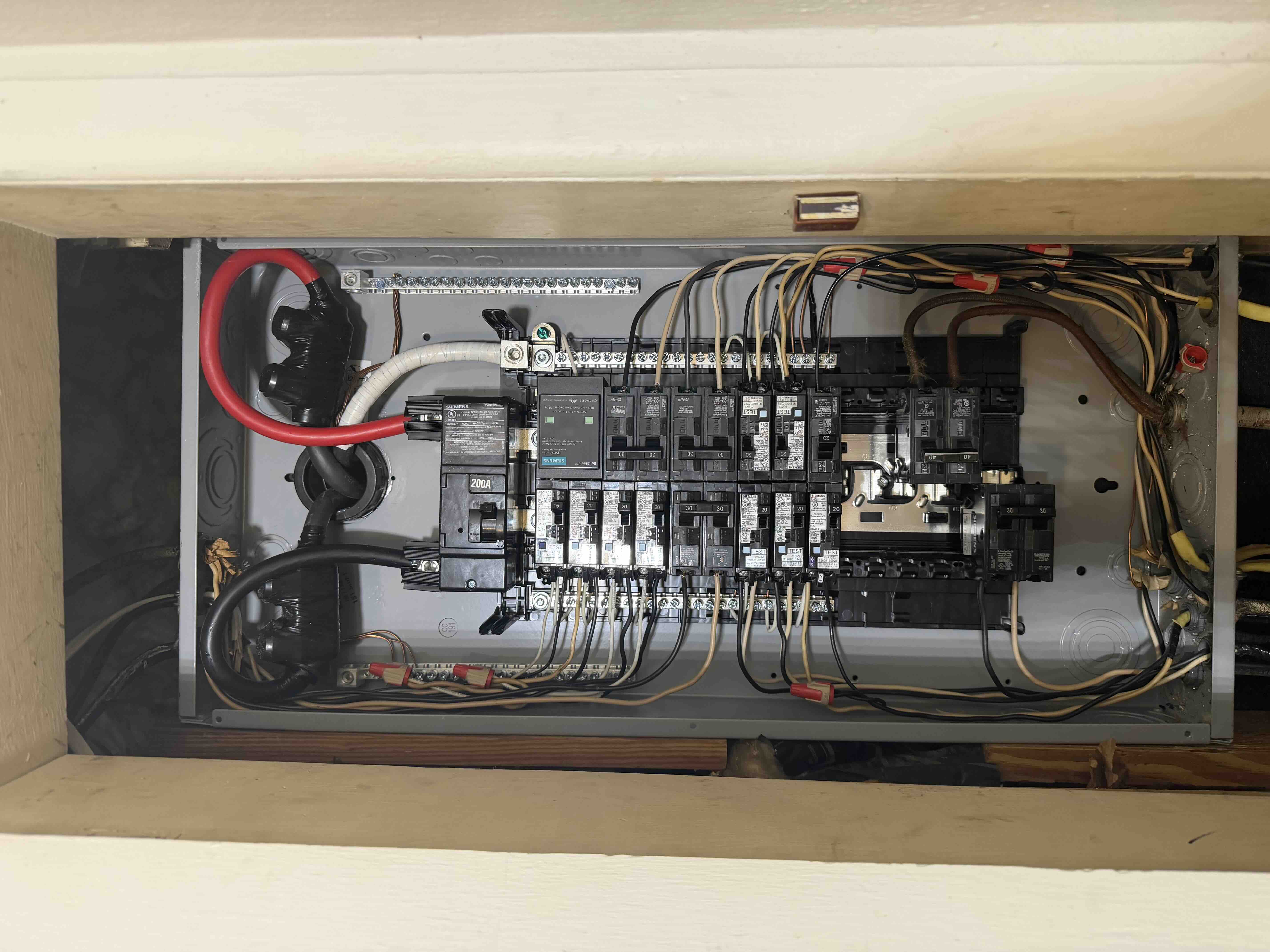 Newly installed Siemens 200 amp residential breaker panel by On Point Electric, with neatly organized wiring and labeled circuits