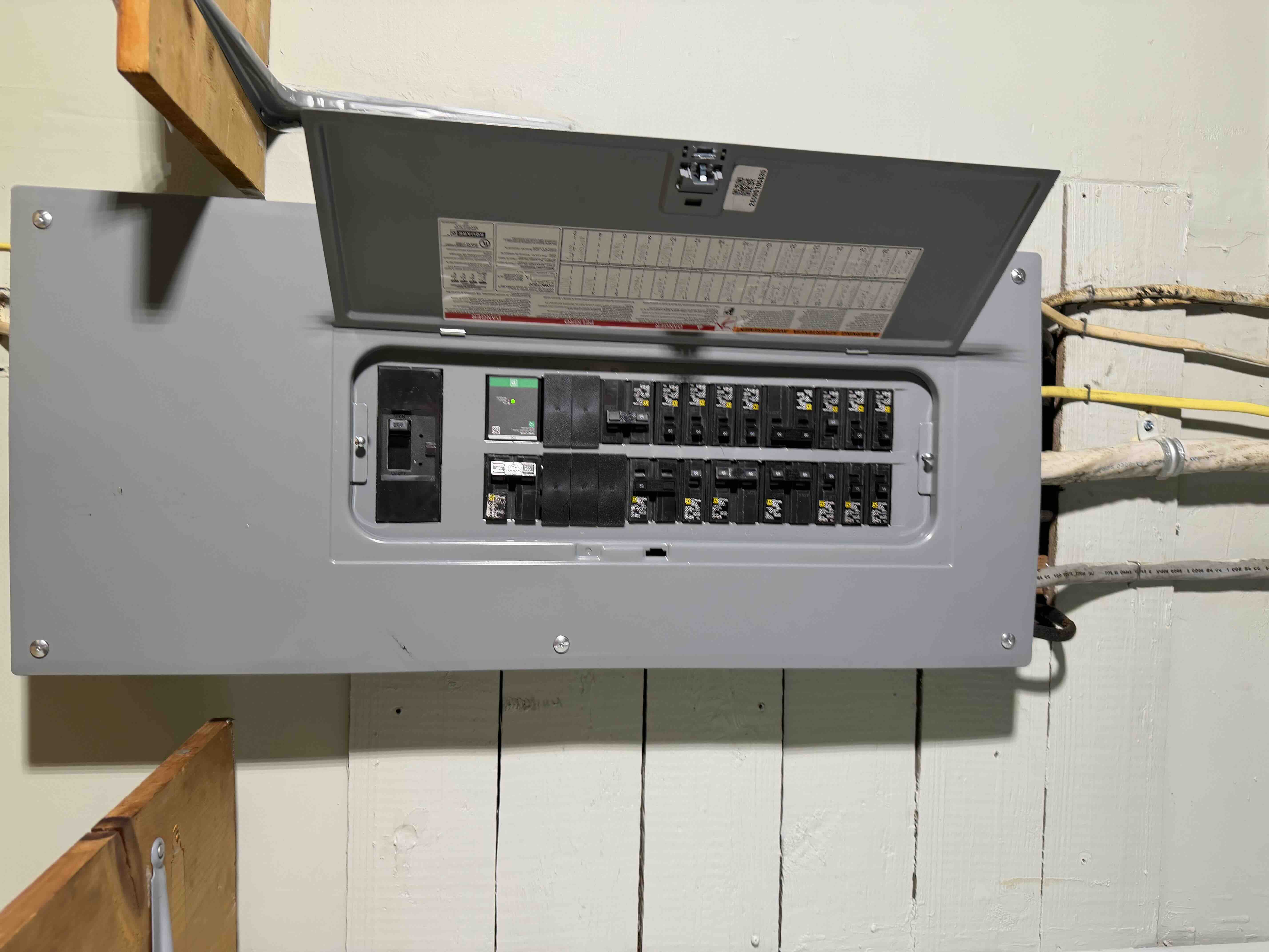Completed Square D breaker panel installation with clean deadfront cover by On Point Electric