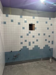Custom blue and white square mosaic tile scattered accent wall with white field tile and purple ceiling under construction by Level 4 Tile and Stone San Diego