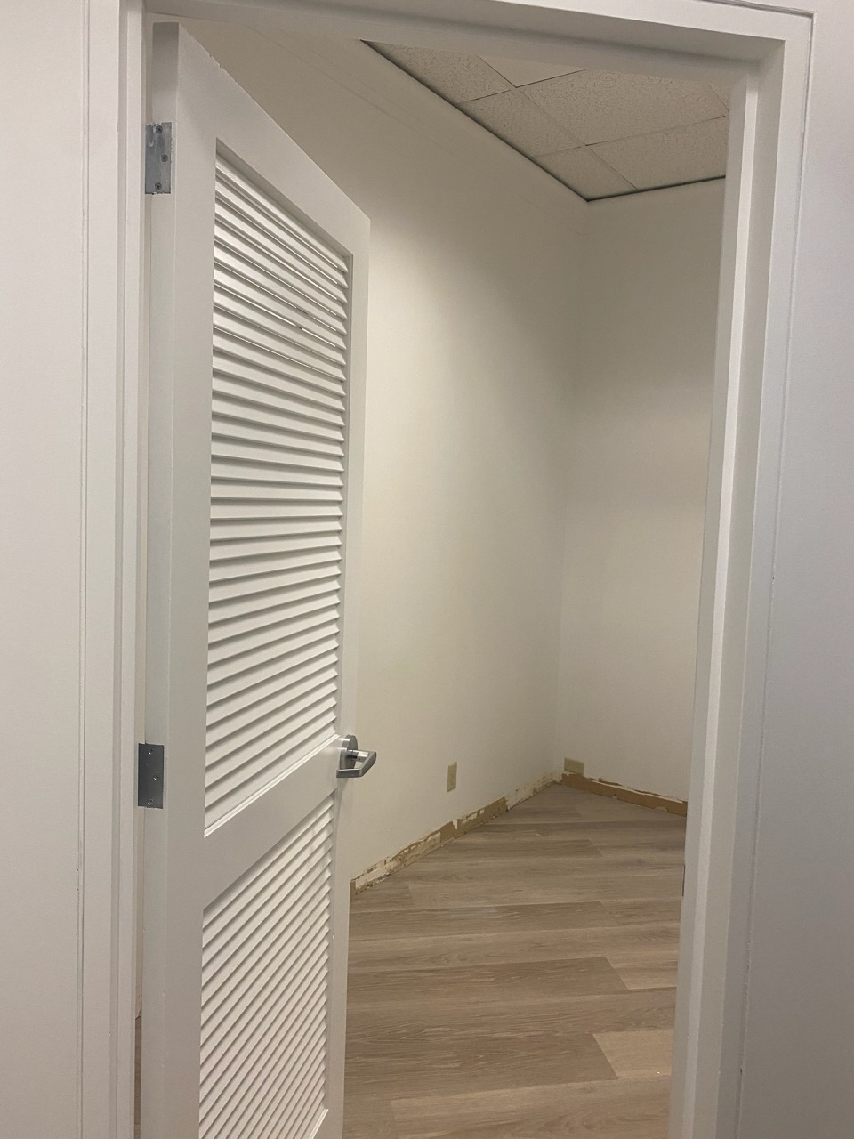 Interior Room — Fresh White Walls & Louvered Door Painted