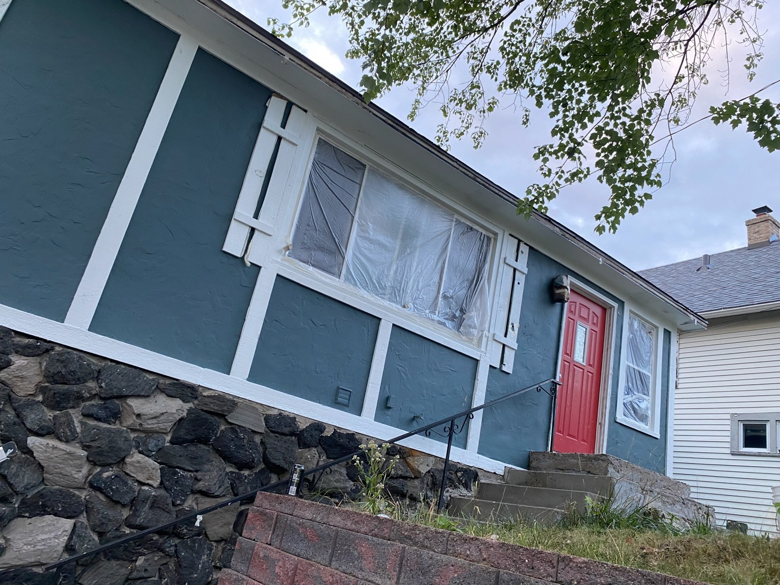 Exterior Facade — Deep Teal with Bold Red Front Door Accent