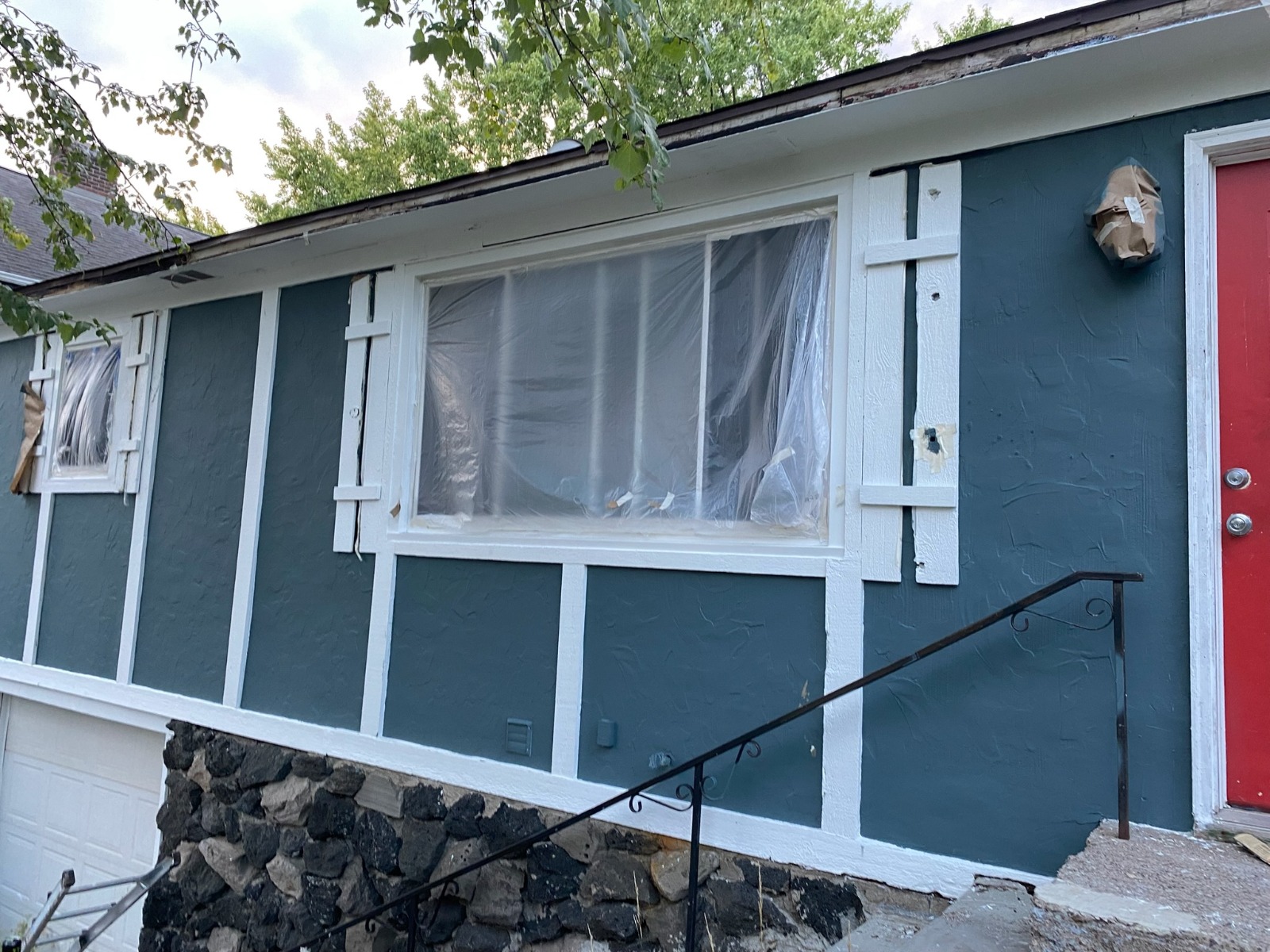 Exterior House — Teal Siding with White Trim & Stone Foundation