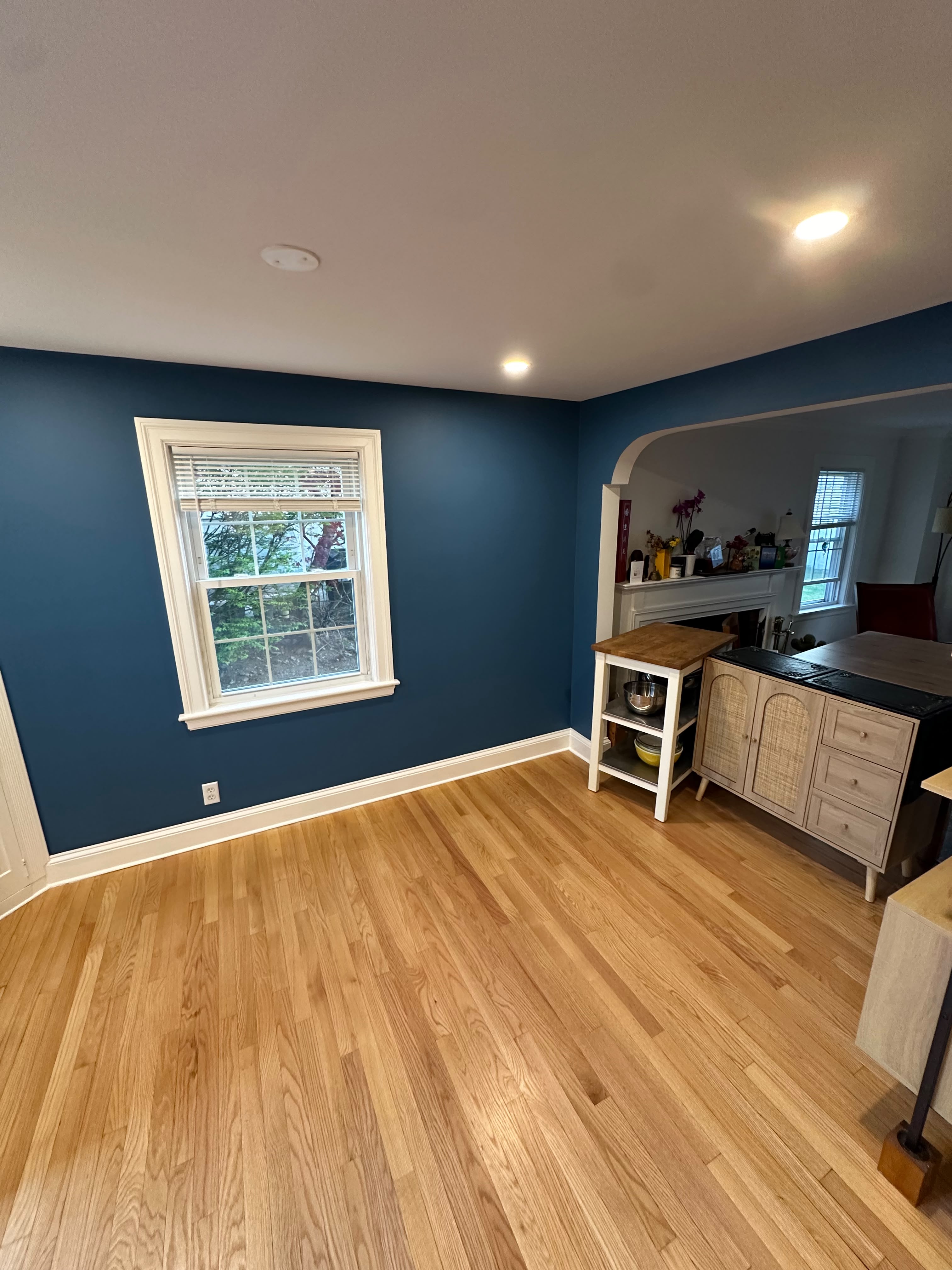 Interior painting — freshly painted living room with a deep blue accent wall in Sterling MA