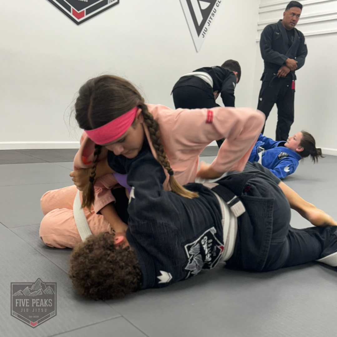 Kids sparring during jiu jitsu class at Five Peaks Jiu Jitsu in Tierrasanta