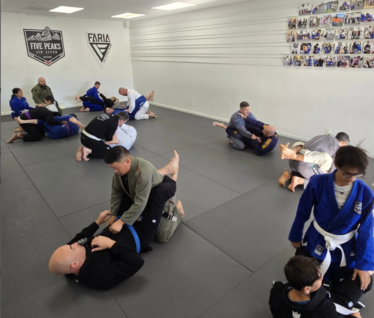 Adults grappling during no-gi jiu jitsu training at Five Peaks Jiu Jitsu