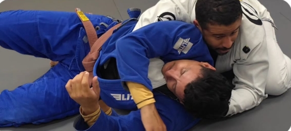 Coach demonstrating side control submission technique during private lesson at Five Peaks Jiu Jitsu