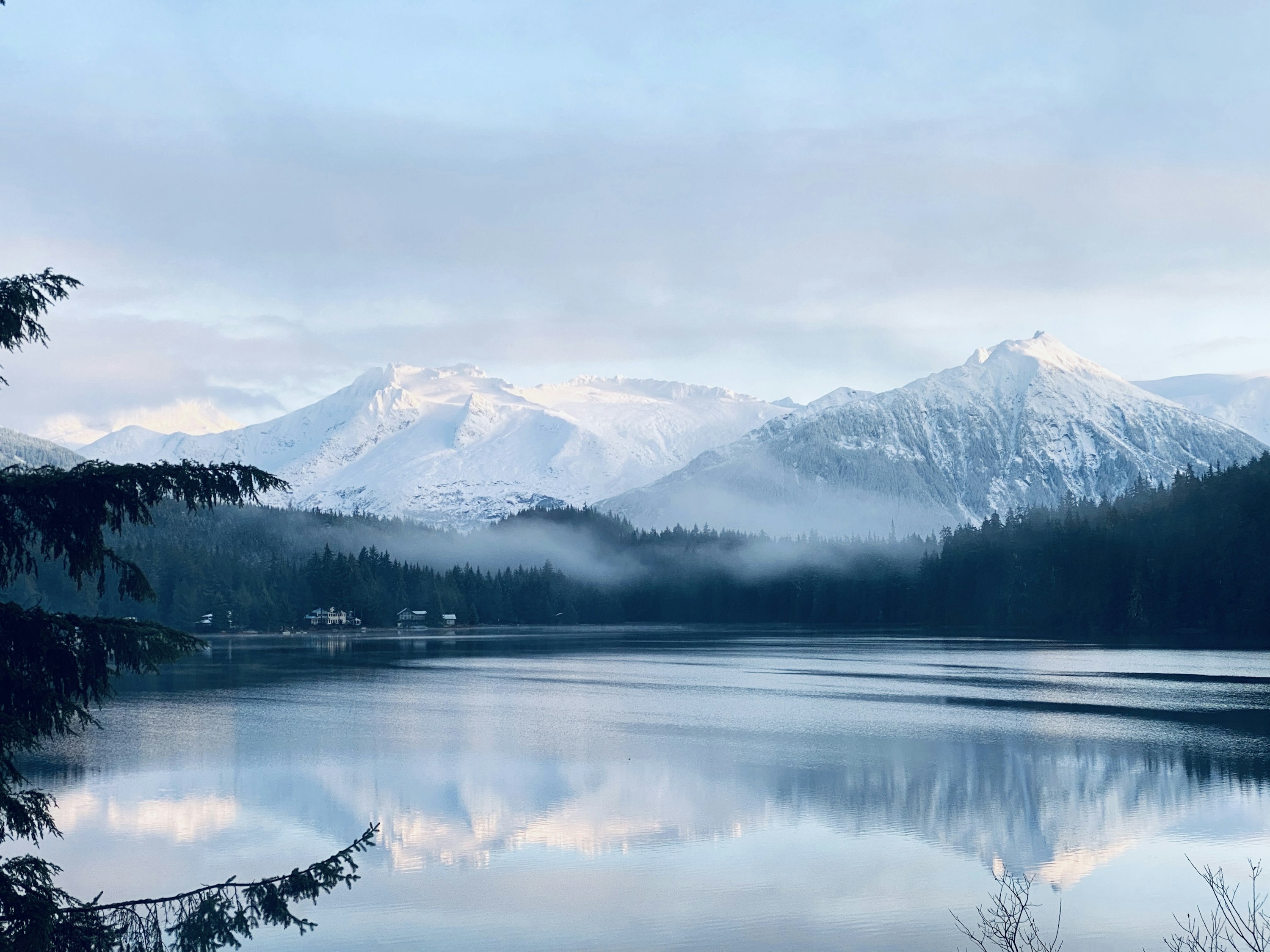 Mountain ranges reflected in an alpine lake in Alaska — inspiring US adventure landscape