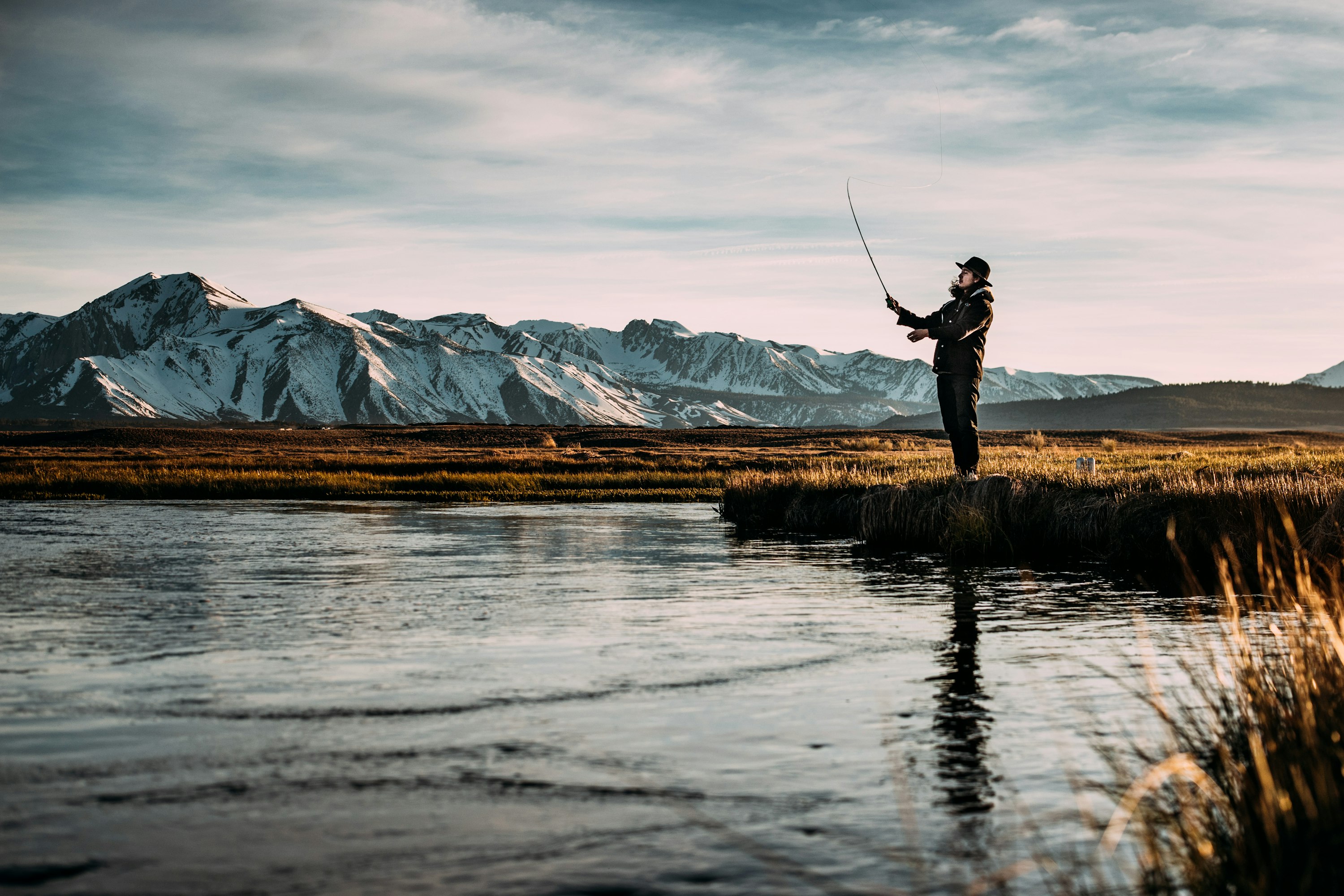 Fly-fishing river in golden evening light — steelhead country adventure landscape