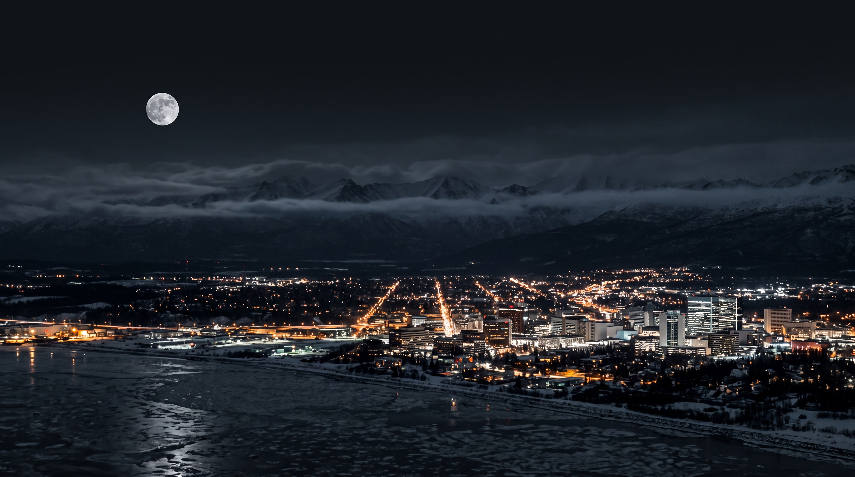 Anchorage, Alaska skyline at dusk — cinematic dark establishing shot