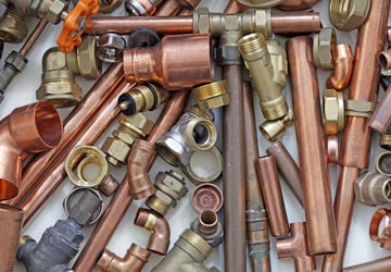 Plumbing pipe, valves, and fittings on the supply counter