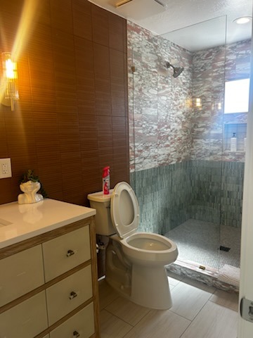 Before cleaning: Bathroom tile and glass shower area requiring deep cleaning