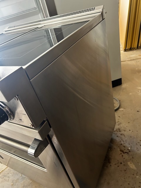 After cleaning: Sparkling clean, polished stainless steel stove