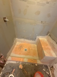 Schluter Kerdi waterproof shower pan, integrated bench, and central drain installation