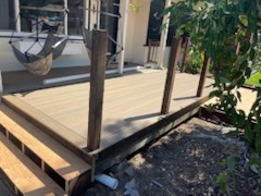Custom outdoor wood deck construction with stepped entry