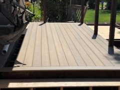 Newly built composite deck installation with clean plank finish
