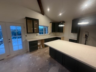Vaulted ceiling kitchen remodeling project with custom island crafted by Handyman Carlos Service LLC