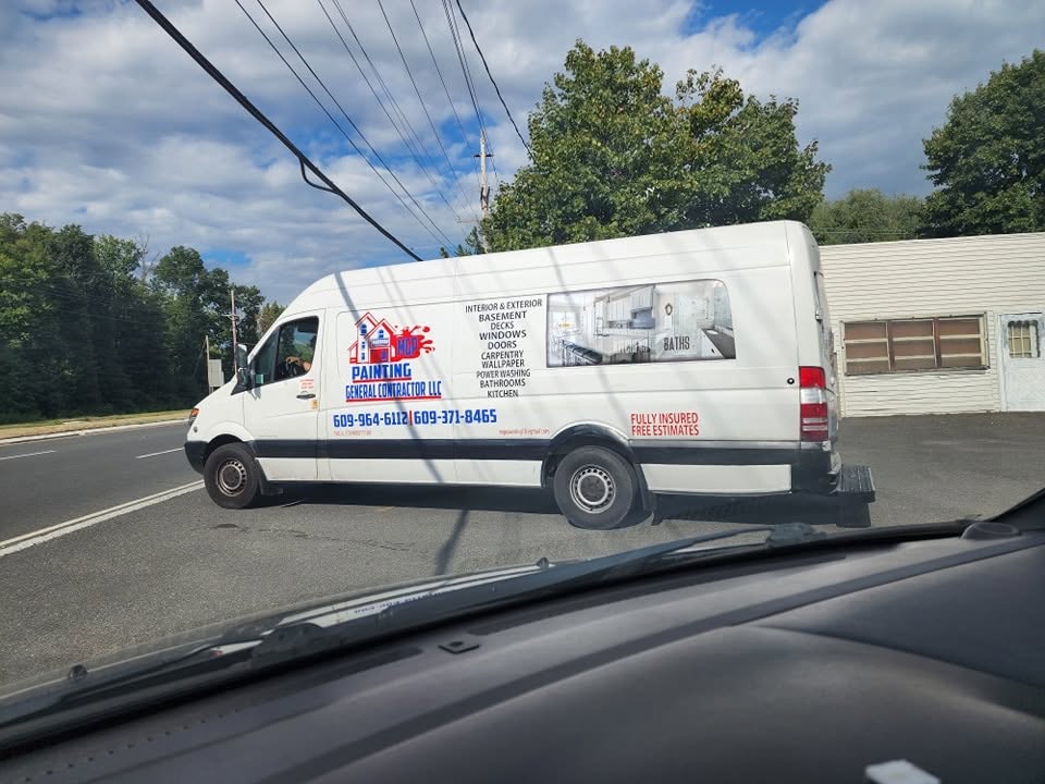MGP Painting LLC crew van on a commercial job site