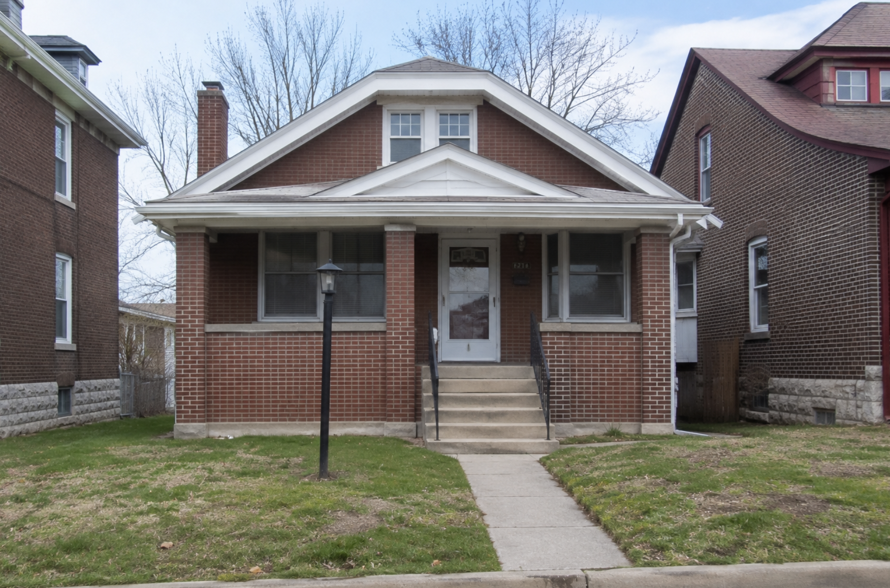 A historic red brick two-family flat in St. Louis City