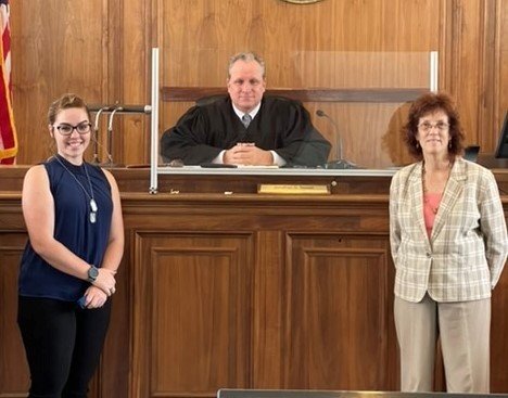 Participants with a judge during a CASA of Caroline swearing-in ceremony in May 2021.