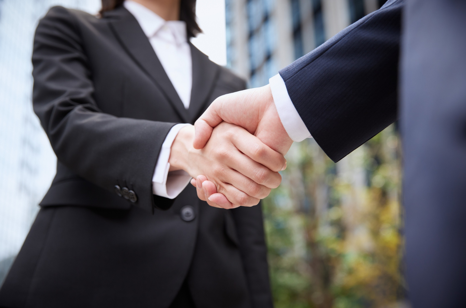 Business partners shaking hands after forming a new Oklahoma business