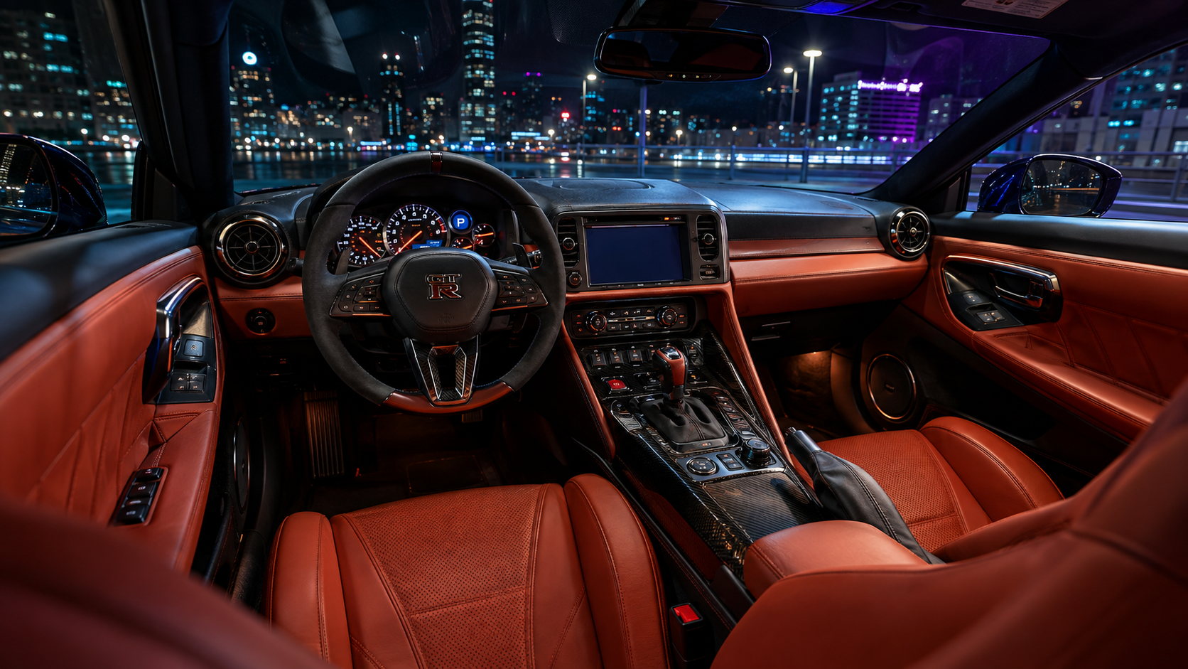 2024 Nissan GT-R Premium interior featuring Amber Red semi-aniline hand-stitched seats and cockpit