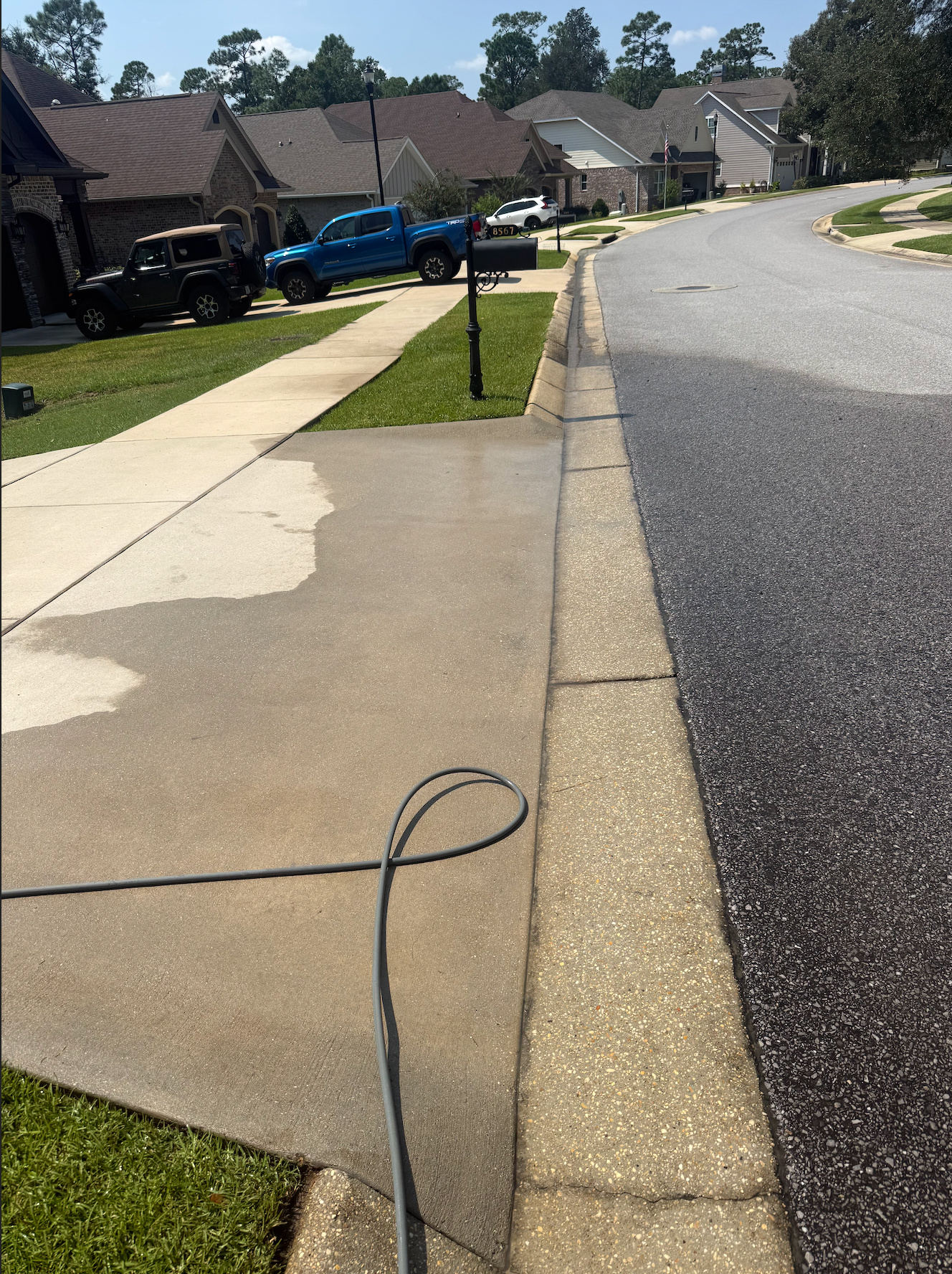 Residential Concrete Driveway Restoration before pressure washing by Panhandle Precision Pressure