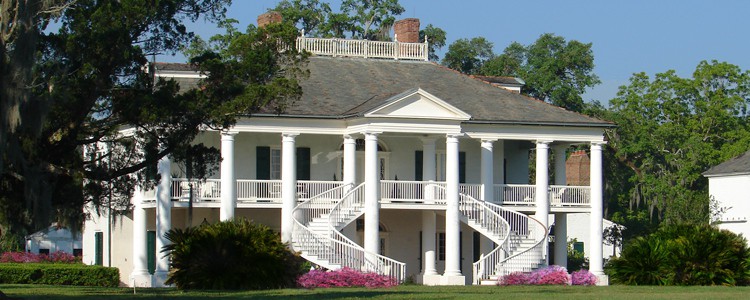 Grand antebellum mansion with sweeping curved staircases and white columns