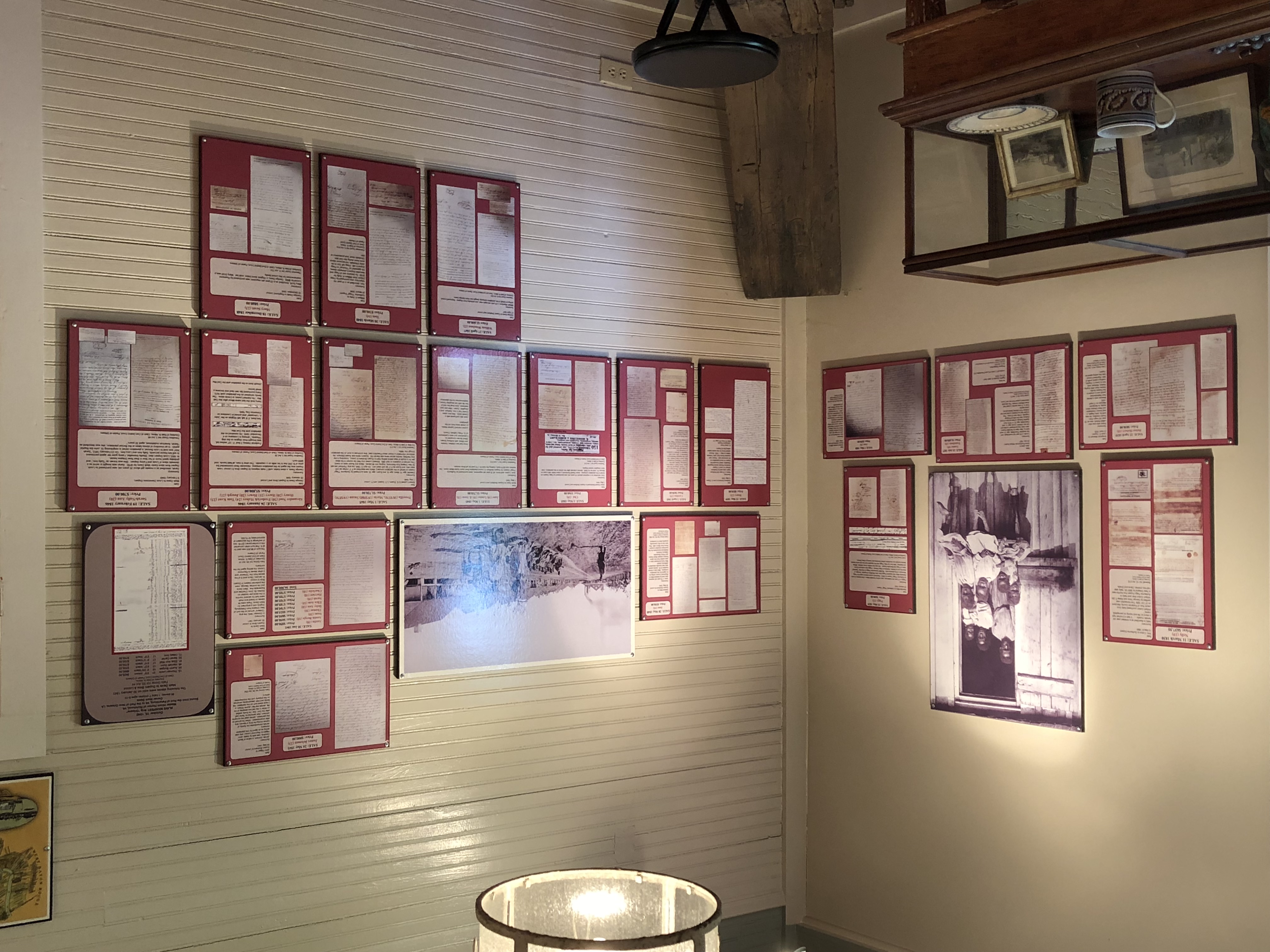 Plantation archive wall displaying historic documents and records exhibits