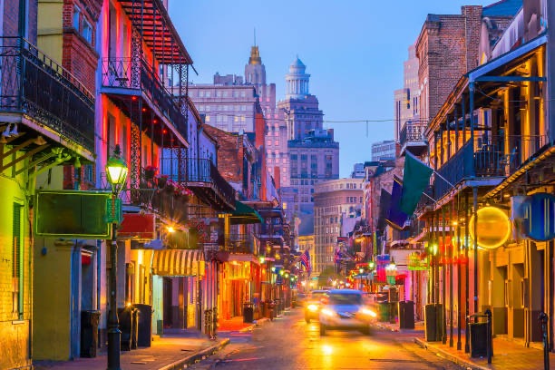 Vibrant French Quarter street scene with colorful twilight lights
