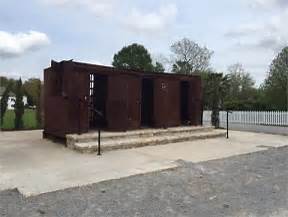 Historic iron boxcar slave memorial exhibit on plantation grounds