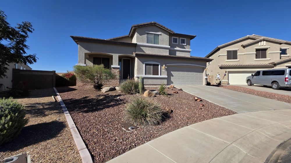 Drought-tolerant front yard landscaping with cacti and native shrubs