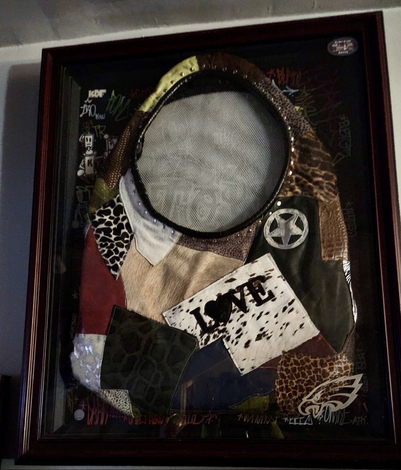 Framed one-of-one mixed-leather and graffiti wearable art piece by Kosher Misfit