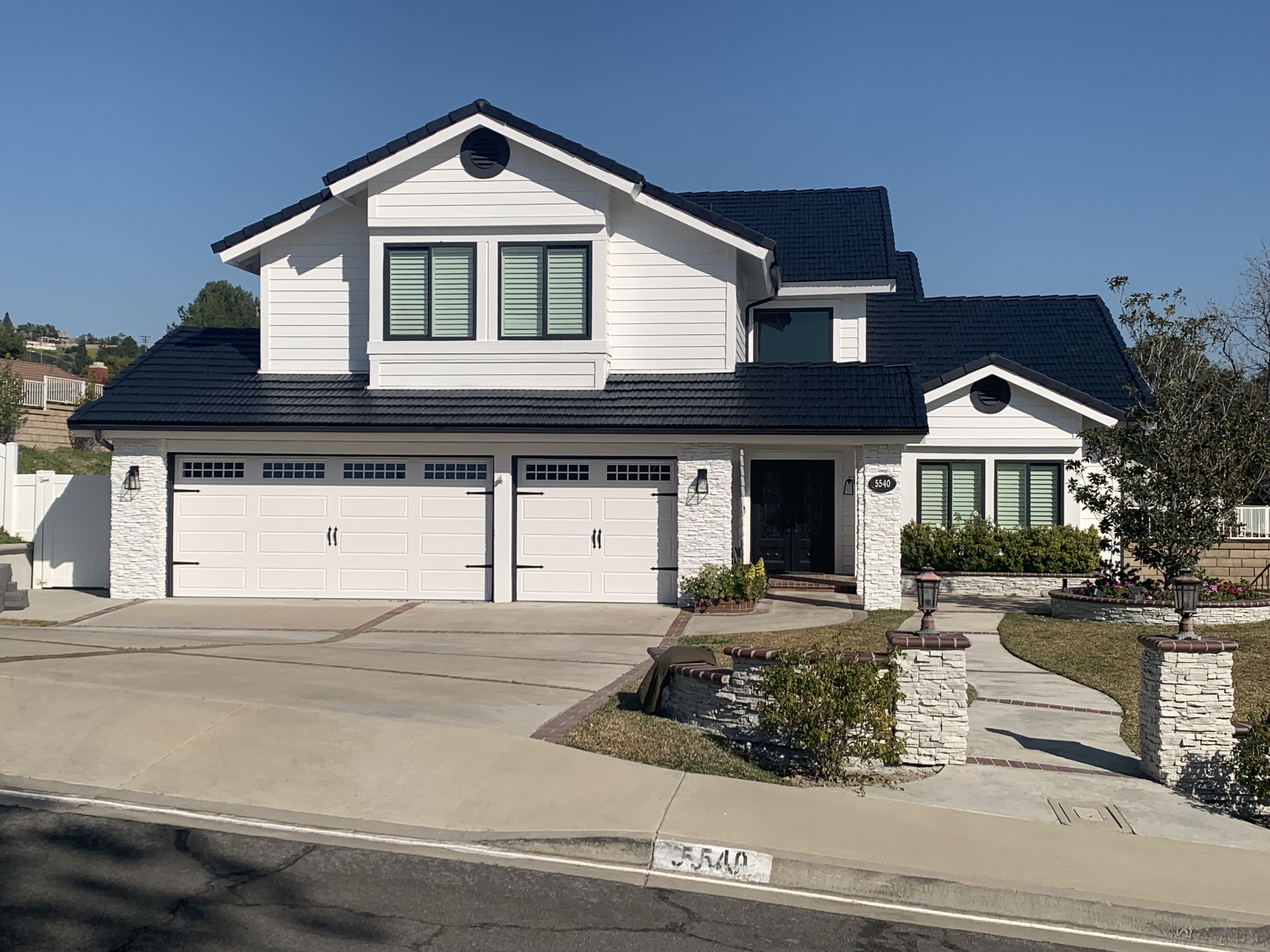Two-Story Craftsman Modern White & Dark Charcoal Roof