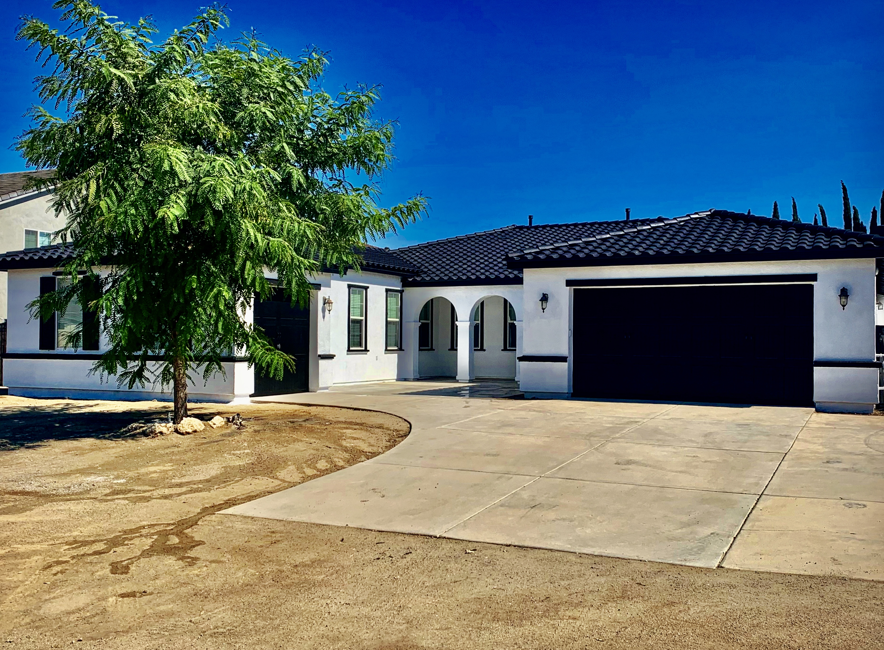 Modern White Stucco Exterior with Crisp Black Trim