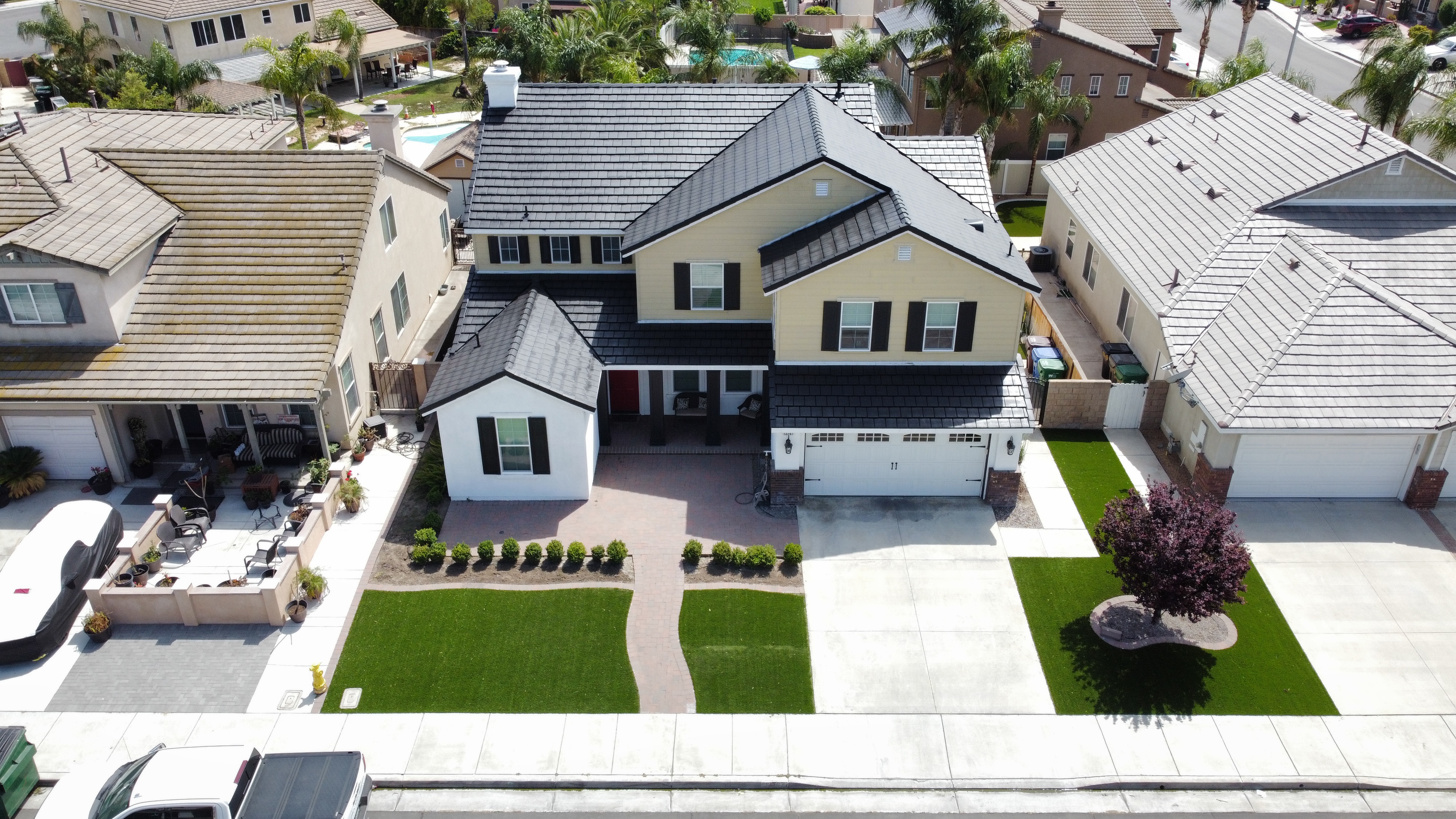 Two-Story Exterior Repaint & Black Tile Roof Makeover