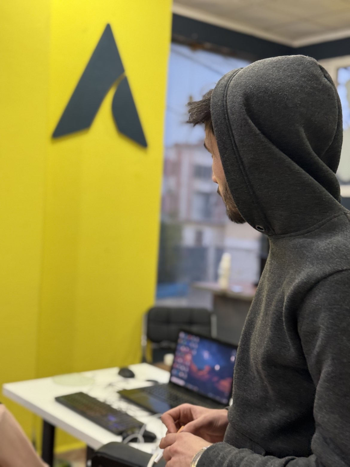 Achraf GCM at Adzone headquarters looking at the logo