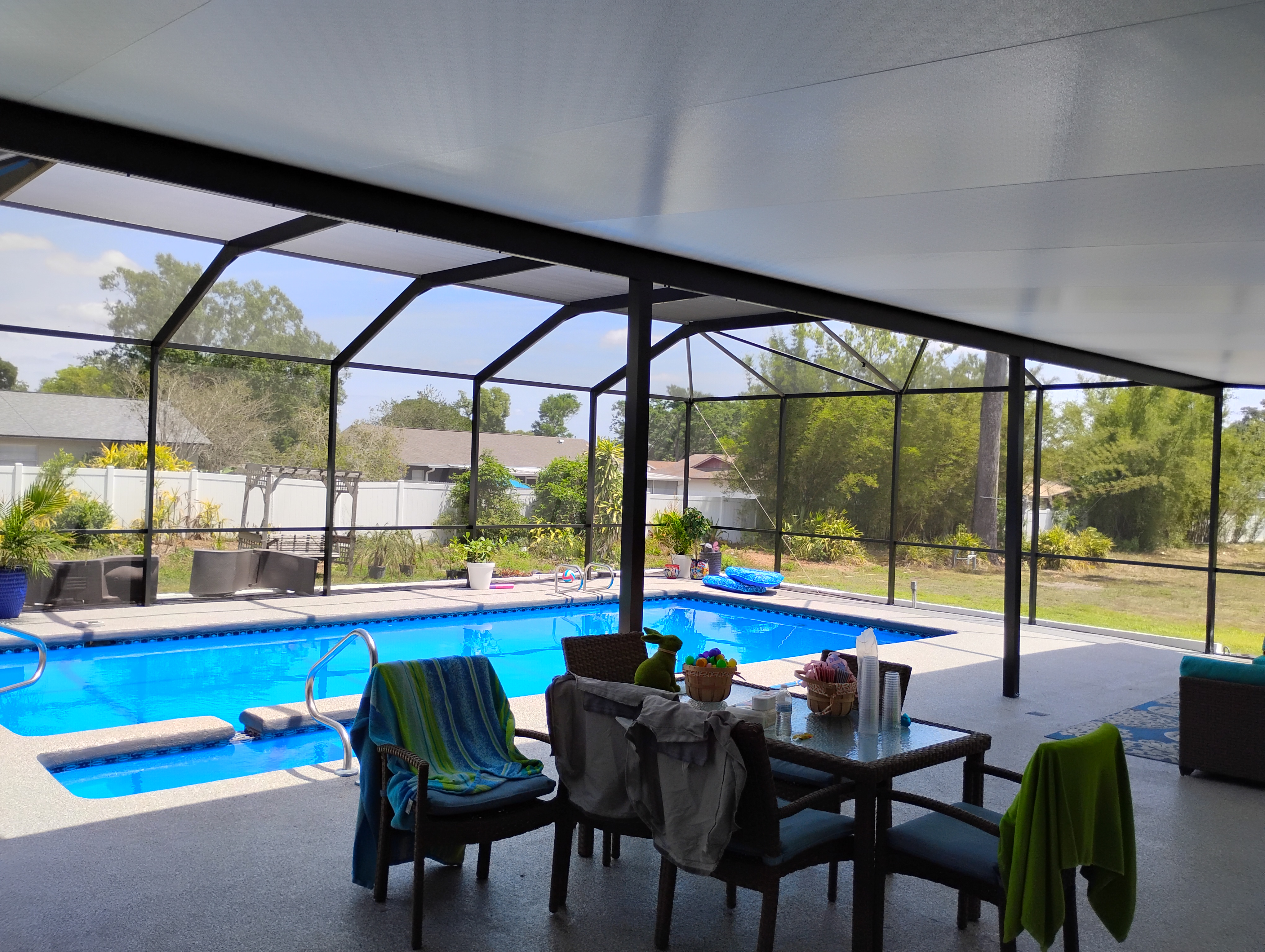 Furnished lanai living space with screen enclosure in Brandon, FL by Screen Boss