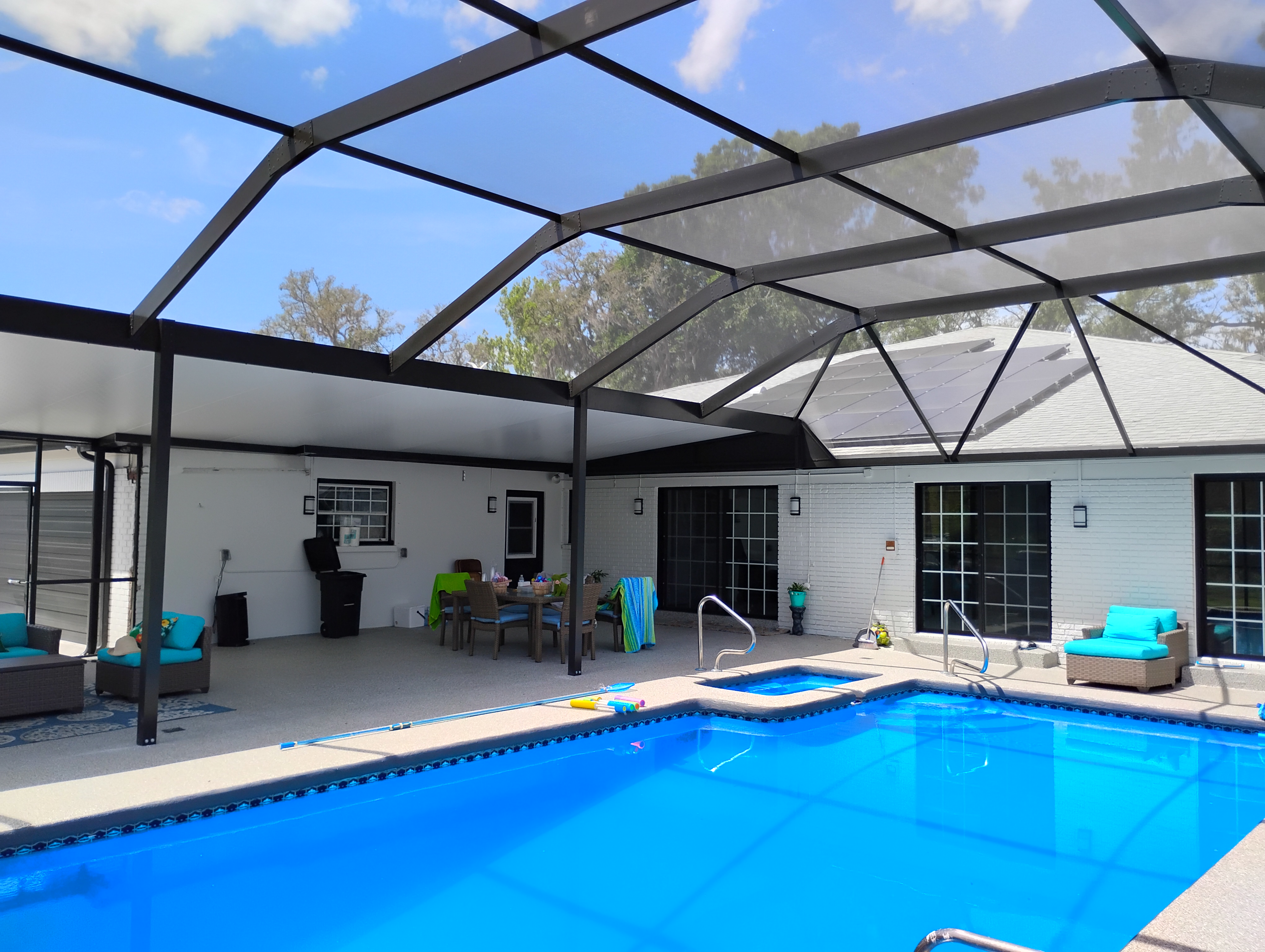 Custom pool cage and insulated patio roof installation in Brandon, FL