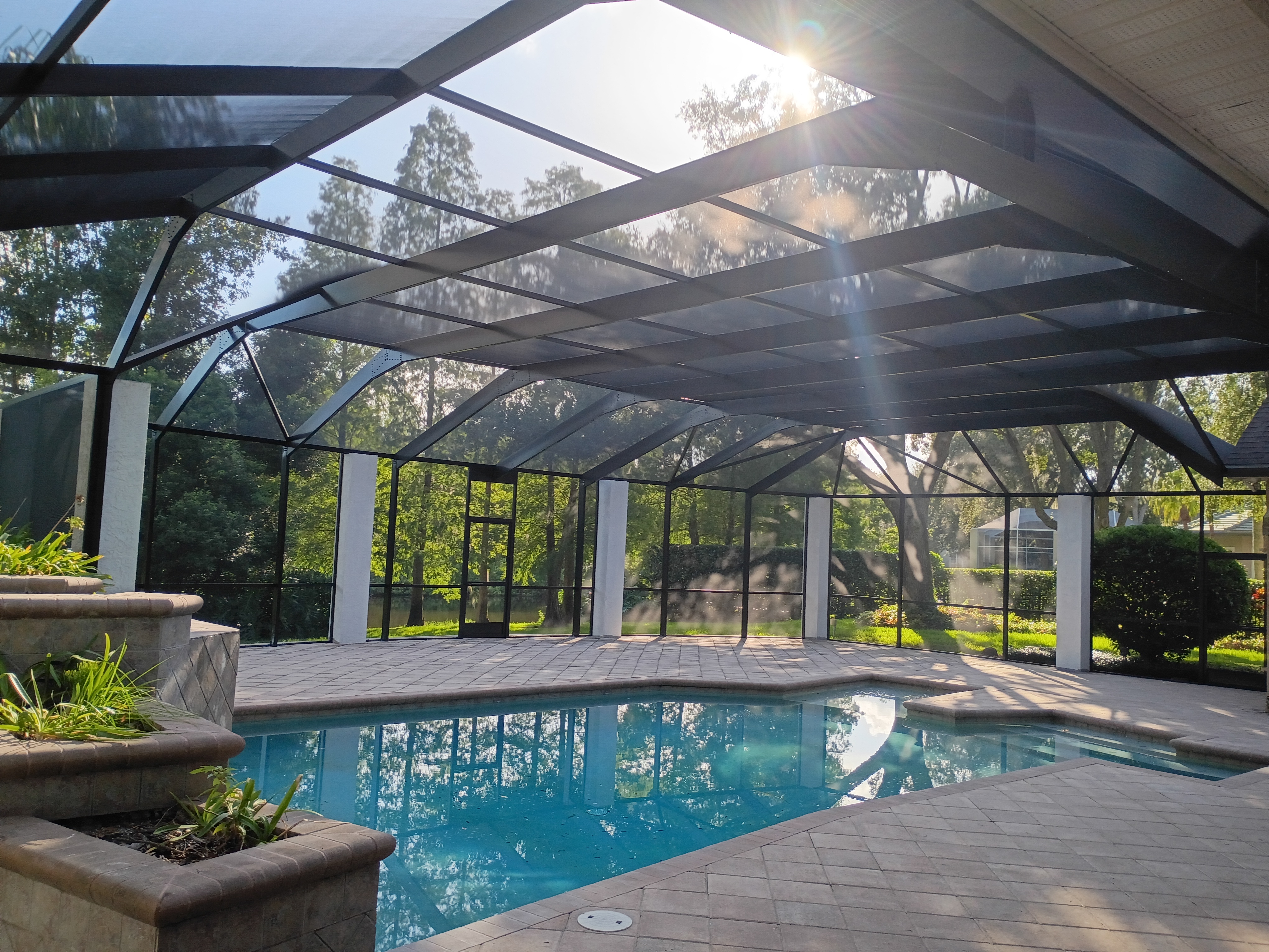 Custom pool enclosure with concrete columns in Avila, Tampa, FL