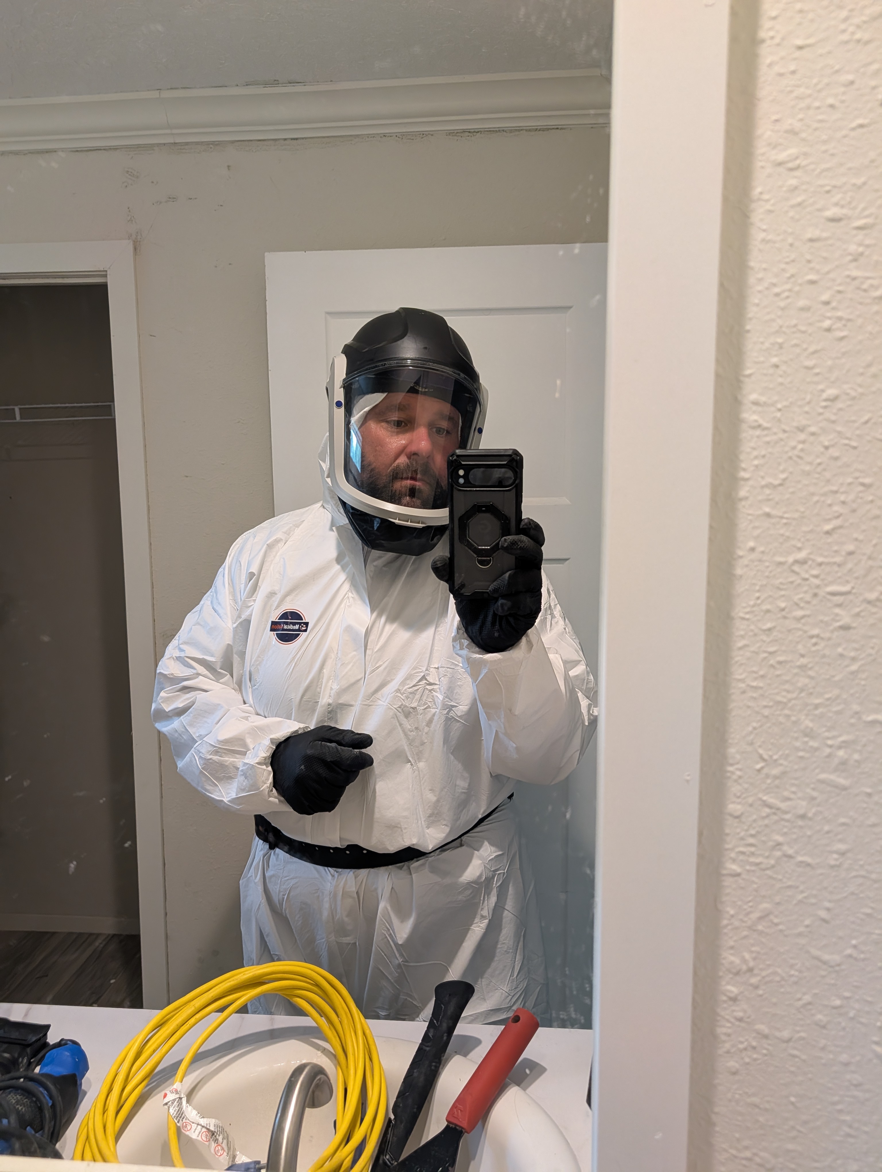 Devon Morante in professional remediation and PPE gear