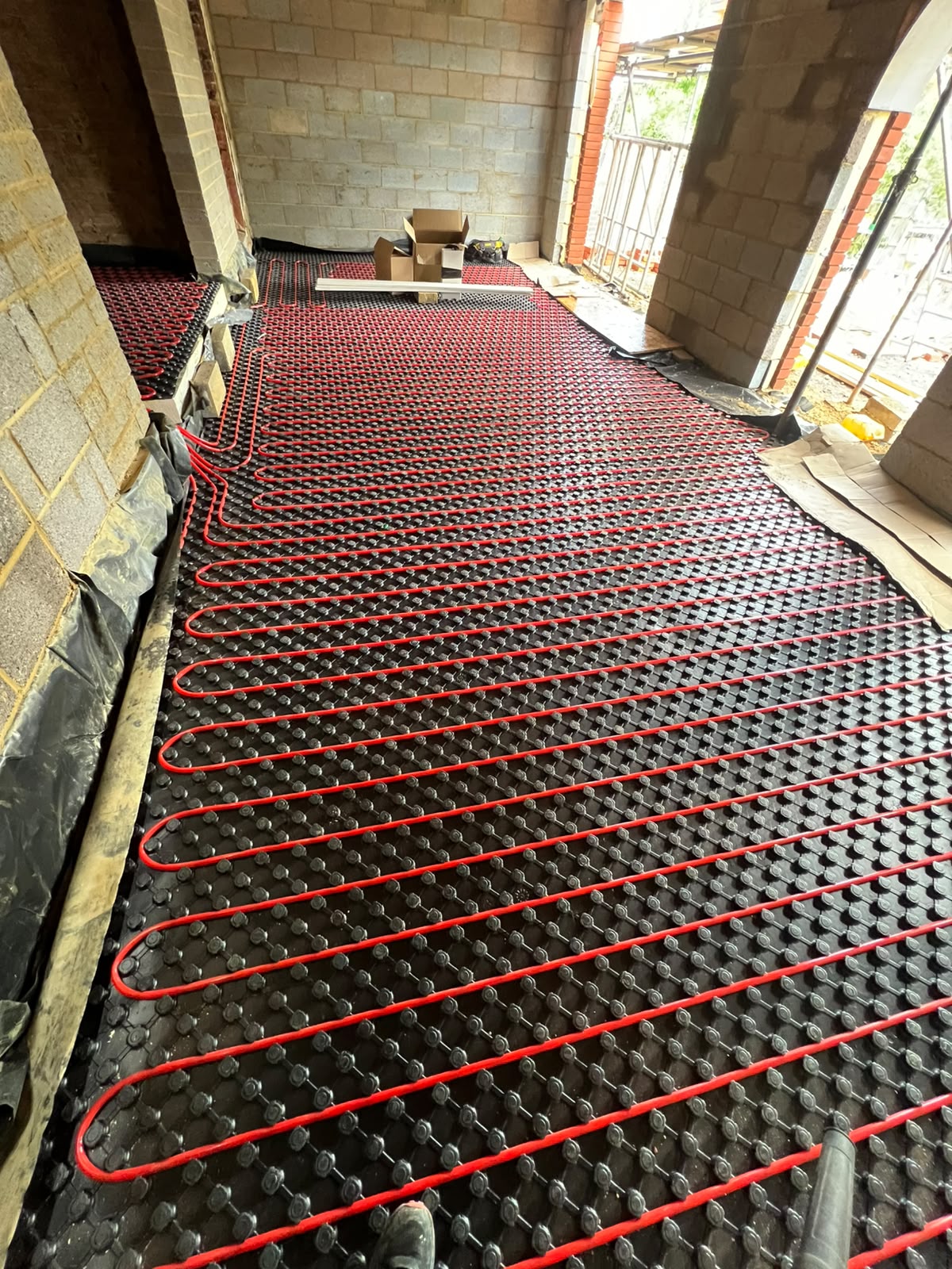 Underfloor heating pipe layout across subfloor