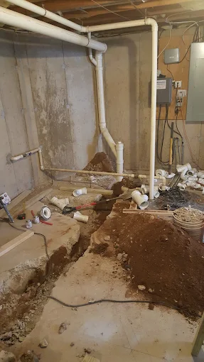 Subfloor concrete jackhammering and dirt excavation for basement bathroom PVC drain pipe rough-in Midtown Atlanta GA Subfloor concrete jackhammering and dirt excavation for basement bathroom PVC drain pipe rough-in Midtown Atlanta GA